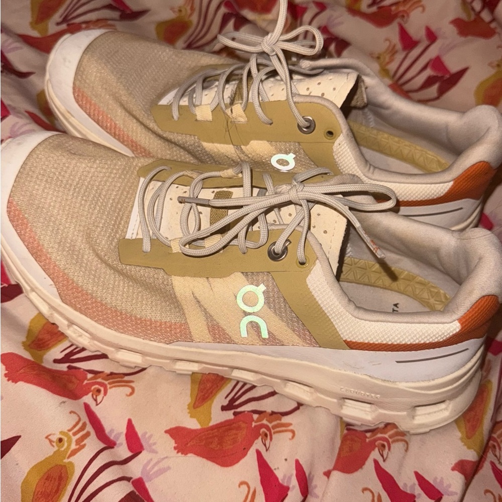 On Running Cream and Orange Athletic Shoes